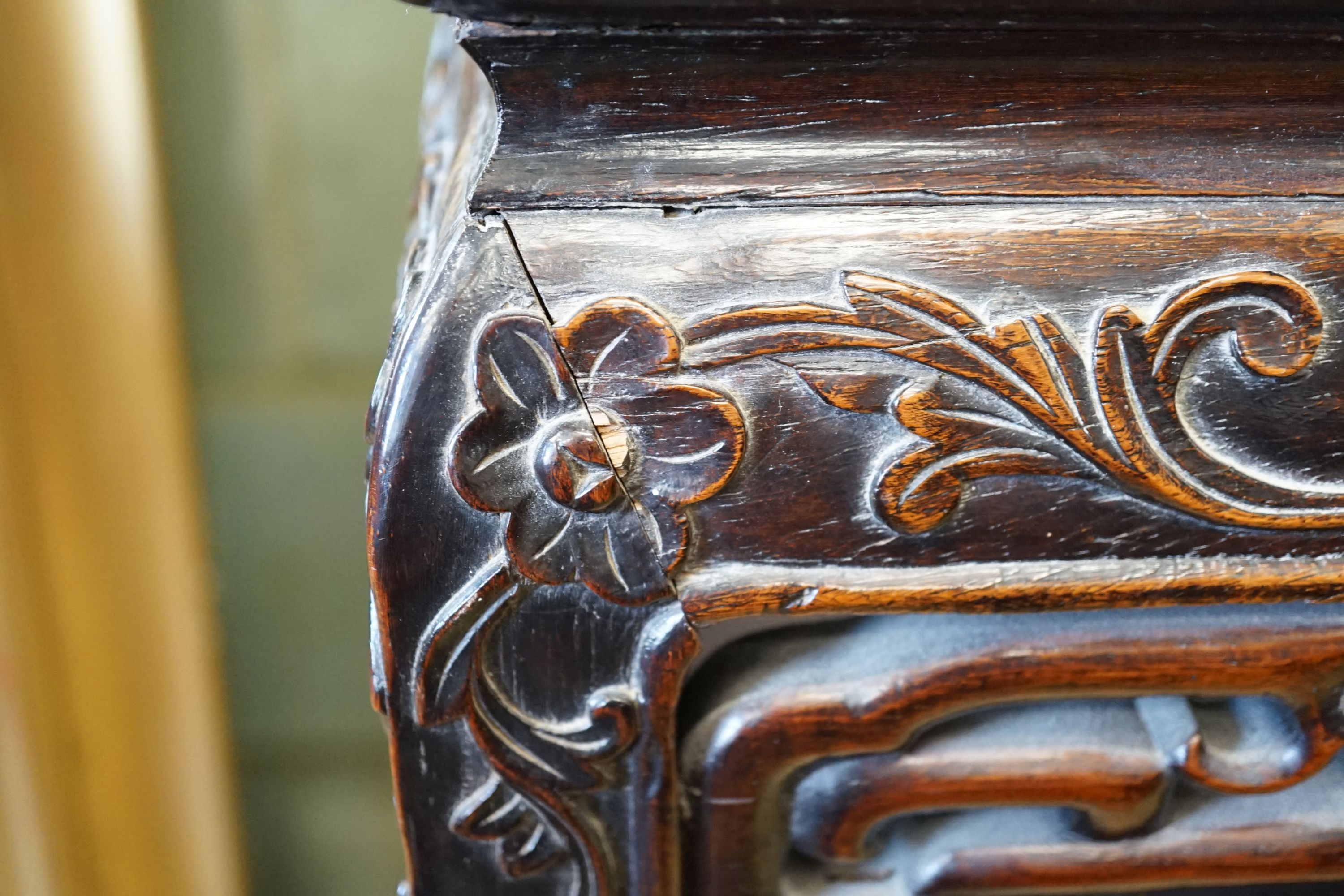 A Chinese carved hardwood rouge marble topped two tier vase stand, width 41cm, height 81cm